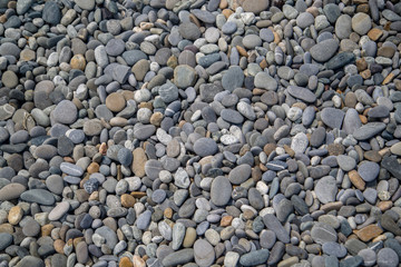 pebble beach background small flat stones