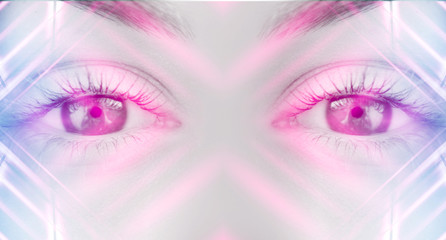 Eyes of   female on a bright abstract background with holograms