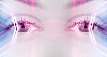 Eyes of   female on a bright abstract background with holograms