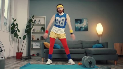 Funny stupid-looking reto fitness man dancing enjoying music and warming up on workout in the living room. - Powered by Adobe