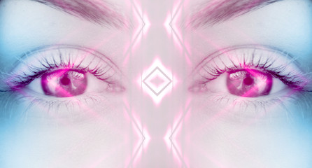 Eyes of   female on a bright abstract background with holograms
