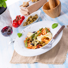 colorful farfalle with green asparagus olives and parma ham