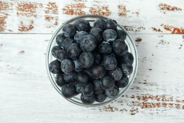 A glass bowl with blueberry
