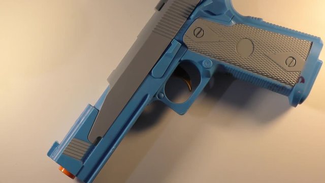 Rotating gun on white wheel with full one circle and round