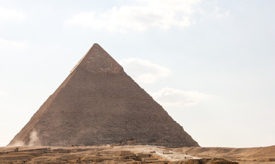Fototapeta na wymiar View of the great pyramid of Pharaoh Khafre, sand covered area of Giza complex