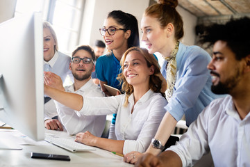 Happy creative team in office. Business, startup, design, people and teamwork concept