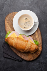 Coffee and croissant sandwich
