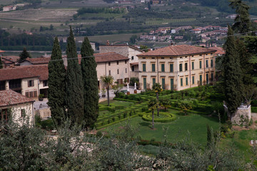 Fototapeta na wymiar Villa Spinosa from the hills of Negrar di Valpolicella, Italy. Construction of the eighteenth century with an Italian garden.