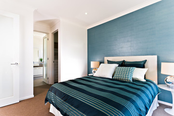 Close up of a blue decorative bedroom to an entrance