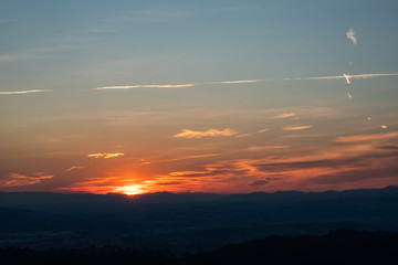 Sunset view on the skyline with mountains and nature