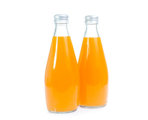 Orange juice in glass bottle isolated on white background