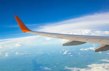 Obraz premium Wing of airplane from window