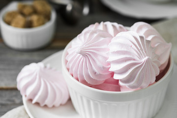 Pink meringue. French dessert. On the grey table