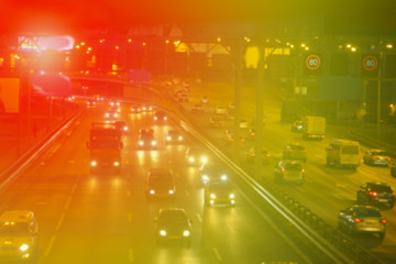 Blurred background. Night city lights blur. Retro toned photo, vintage.