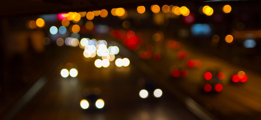 Blurred background. Night city lights blur. Retro toned photo, vintage.