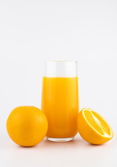 still life photo of orange juice, orange smoothie in glass on white background.