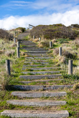 Fototapeta na wymiar The stairs along the Hallett Cove boardwalk around the Sugarloaf rock formation in South Australia on 19th June 2019