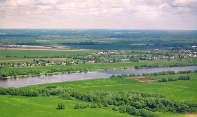 Fototapeta na wymiar Panoramic bird's-eye view of the natural landscape: river, fields