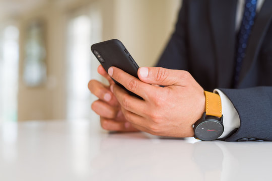 Close up of business man hands using smarpthone