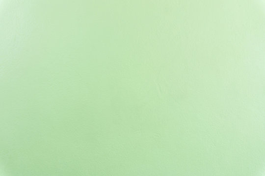 Soft green painted concrete cement texture wall background