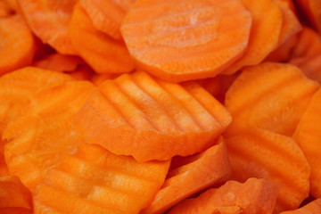 Closeup fresh organic carrot vegetable sliced cycle shape background,healthy vegetarian fiber food