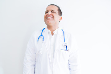 Middle age doctor man wearing stethoscope and medical coat over white background smiling looking side and staring away thinking.