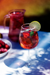 Strawberry lemonade drink, refreshing summer mojito with strawberries, lime and mint.