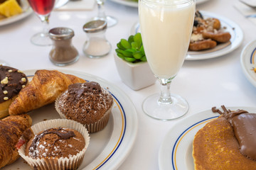 Yogurt and sweet pastry - healthy breakfast concept