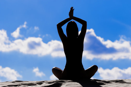 young woman practicing yoga