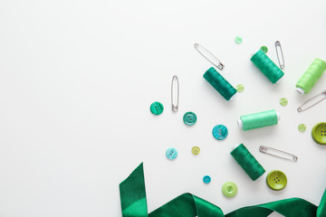 Set of sewing threads and accessories on white background