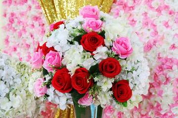 red and pink rose boutique flower decorate in wedding and blur orchid