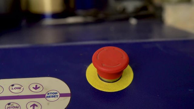 Pressing the red emergency button on the panel