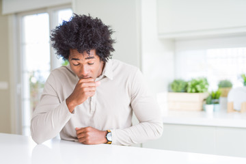 African American man at home feeling unwell and coughing as symptom for cold or bronchitis....