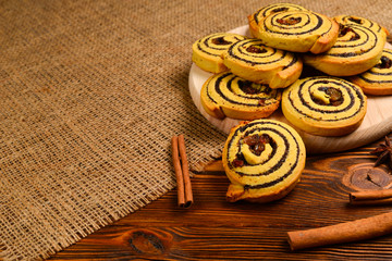 Home made baked cookies with raisins and poppy seeds. Space for text or design.