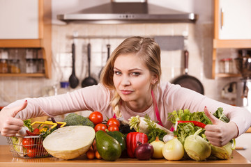 Woman having vegetables on table