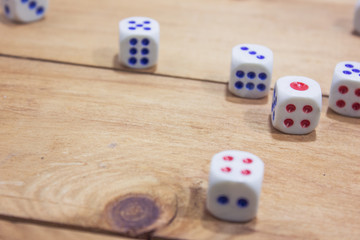 dice on wooden table.