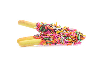 Biscuit stick bread with sweet colorful chocolate isolated on white background