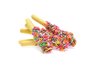 Biscuit stick bread with sweet colorful chocolate isolated on white background