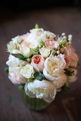 bouquet of flowers on a leg in the interior of the restaurant for the celebration of the flower shop wedding salon
