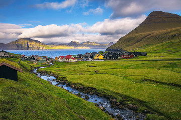 Fototapeta na wymiar Village of Gjogv on Faroe Islands with colourful houses and a creek