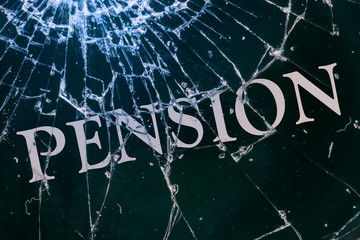 The text "Pension" on the broken glass.