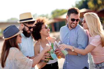Friends celebrate on the beach