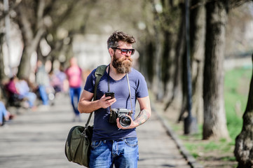 Photographer hold vintage camera. Modern blogger. Manual settings. Photographer with beard and...