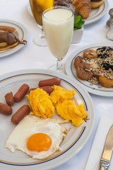 Breakfast with scrambled eggs and a dried fruit