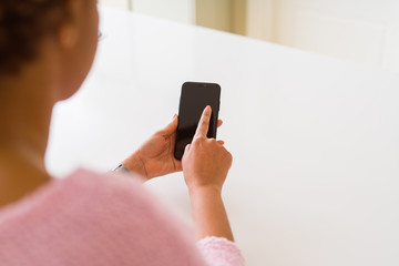 Close up of woman using blank screen of smartphone