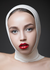 Fashion woman portrait with bright make-up. Long eyelashes and red glossy lips. Face Makeup