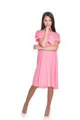 Happy little girl in dress posing on white background