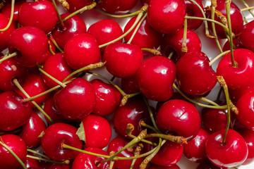 tasty and sweet organic farm cherries, background, top view. farm berries bring many benefits to the human body.