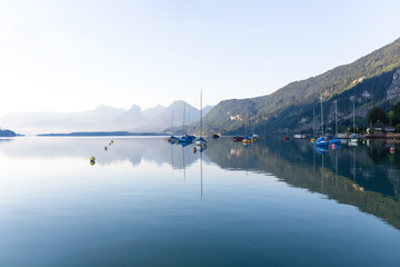 Early morning on the lake shore with yachts and sailboats