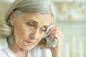 Close up portrait of sick senior woman